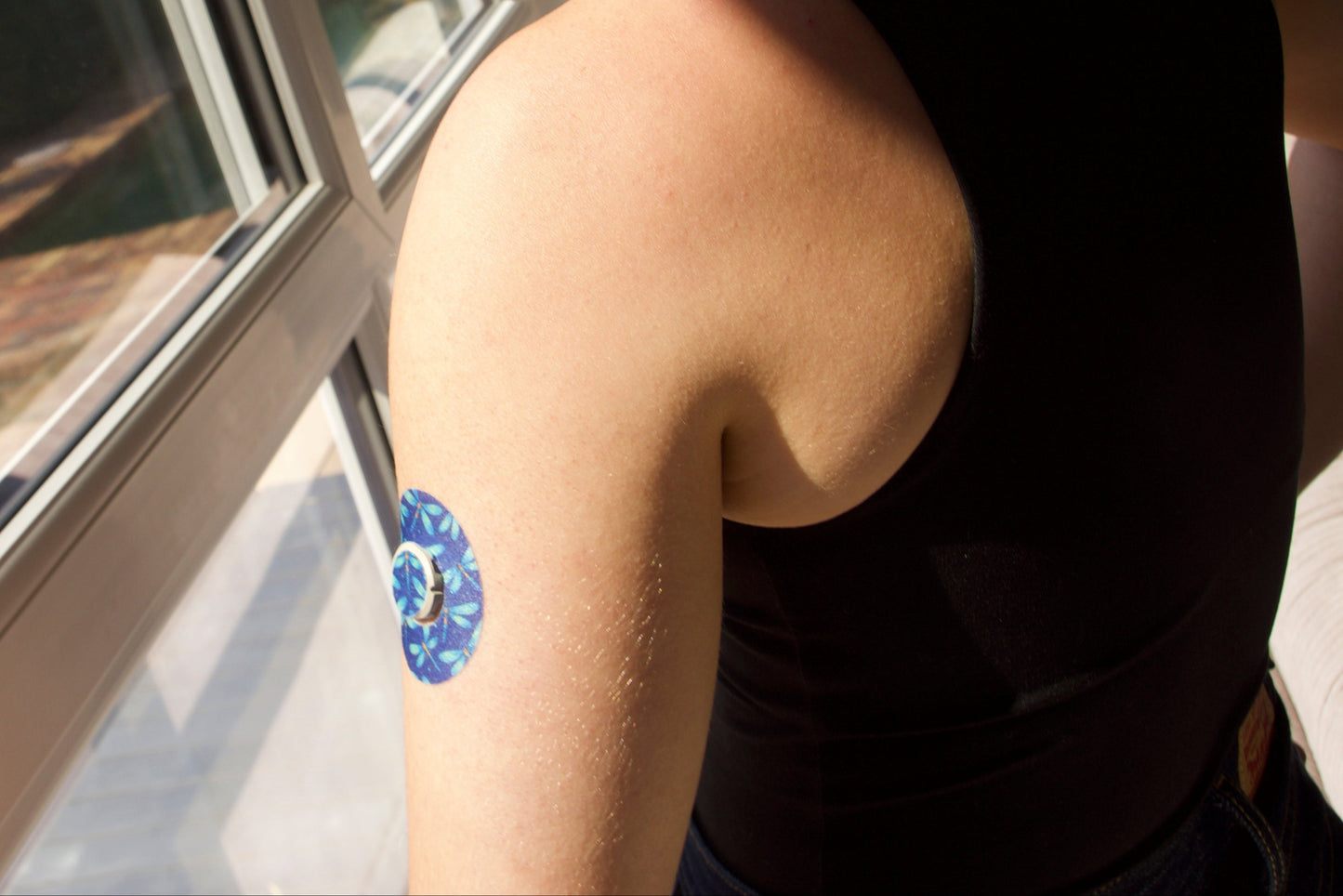 Dragonfly Glimmer CGM patch for Dexcom G7 — dragonflies pattern on dark blue background. Upper Arm .