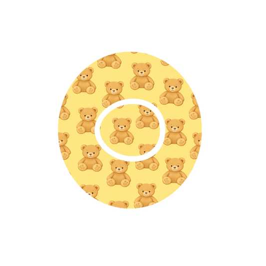 Circular design with teddy bear pattern on a yellow background fits CGM Dexcom One+ and G7 device.