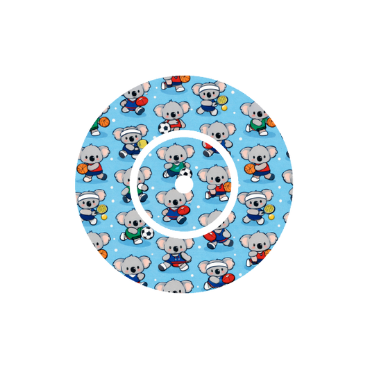 Circular design repeater pattern Binki the koala dressed in sports uniforms - soccer, football, tennis, basketball. Light blue background fits CGM FreeStyle Libre 2 device.