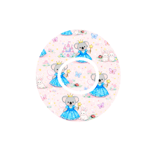 Circular shape Binki the koala dressed as a princess surrounded by lady bugs and butterflies with castles and a blue background fits CGM Dexcom One+ and G7 device.