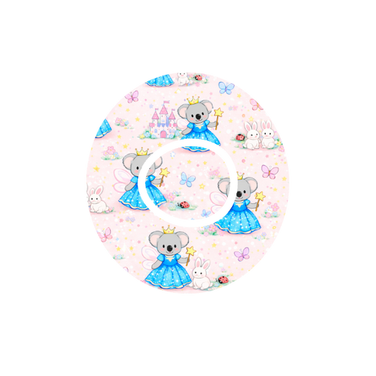 Circular shape Binki the koala dressed as a princess surrounded by lady bugs and butterflies with castles and a blue background fits CGM Dexcom One+ and G7 device.