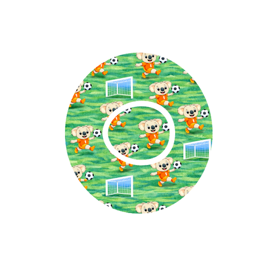 Binki Soccer Stars CGM patch for Dexcom One+ — Binki koala playing soccer on green field

