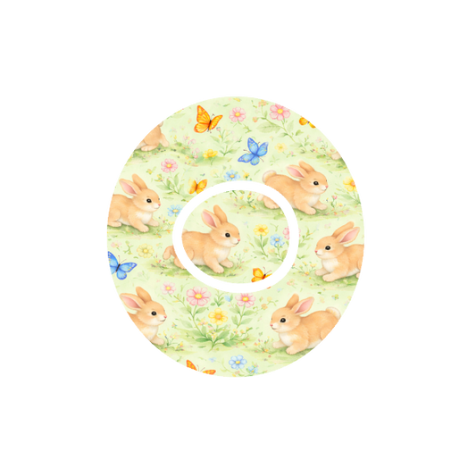 Bunny Meadow CGM patch for Dexcom One+ — animated bunnies with butterflies in flower meadow
