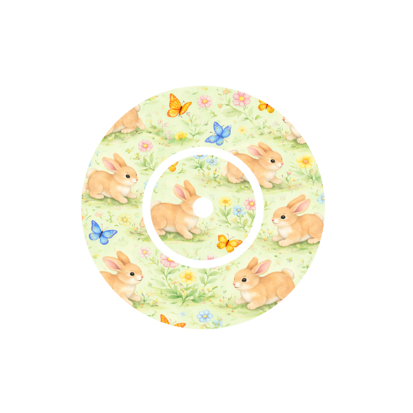 Circular shape soft animated Bunnies playing with butterflies in a meadow of flowers with a cream background fits CGM Dexcom One+ and G7 device.