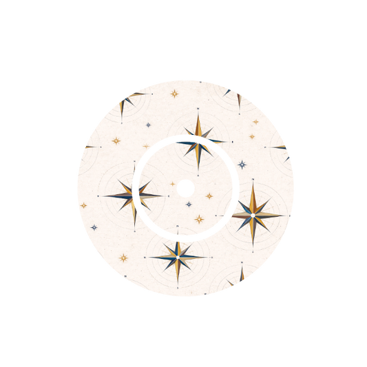 Circular design of compass with  starburst patterns on a stone taupe background fits CGM FreeStyle Libre 2 device.