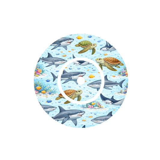 Circular design underwater scene with sharks, rays and turtles swimming on a blue background. Fits FreeStyle Libre 2 device.
