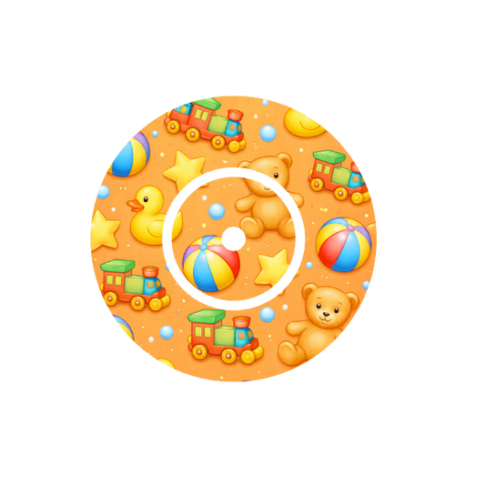 Circular design of colourful  cartoon teddy bear,  train , ducks , stars and various shapes. On a orange  background fits CGM FreeStyle Libre 2 device.